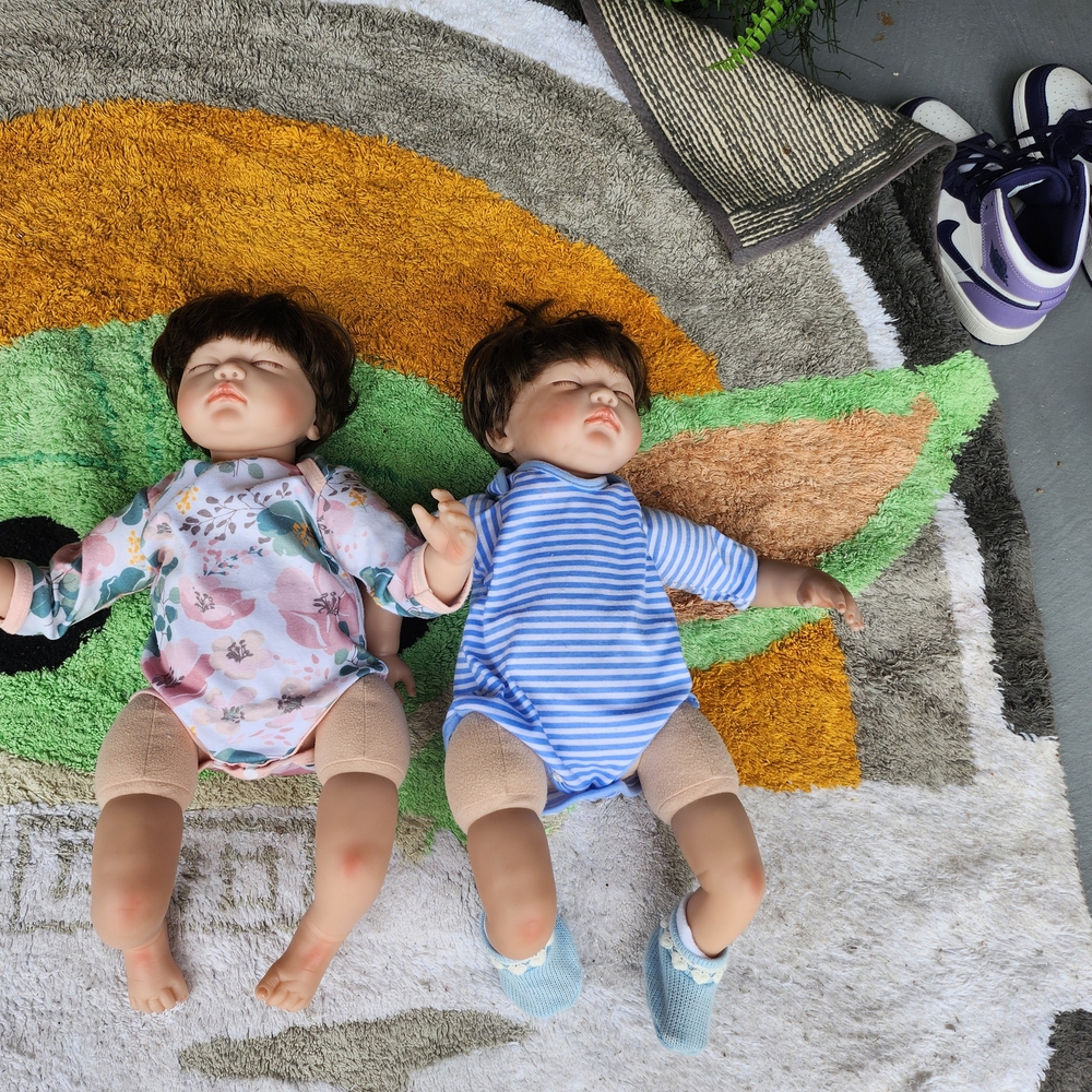 Set of Two Baby Dolls in Floral and Striped Outfits